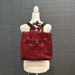 Henri Bendel burgundy tote with cream trim and gold hardware